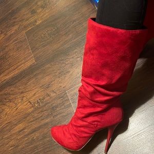 Red suede stiletto boots. That’s all.